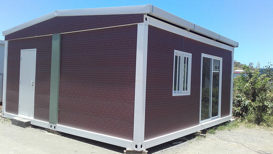 Prefab container with exterior wall cladding