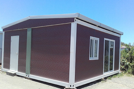 Prefab container with exterior wall cladding